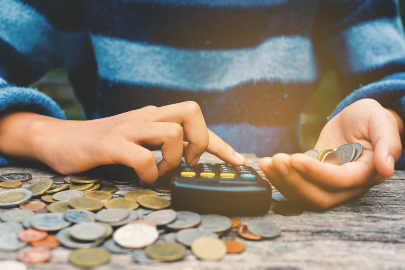 Student counting money and learning budgeting skills