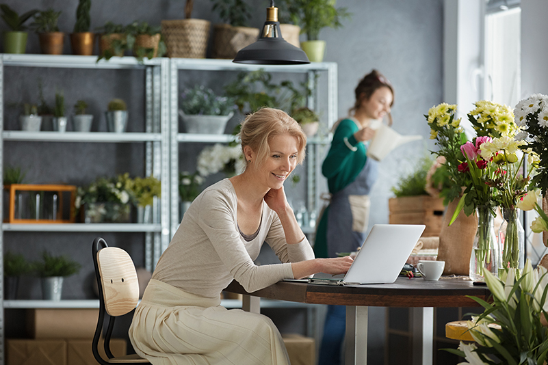 A small business owner applying for a business loan online.