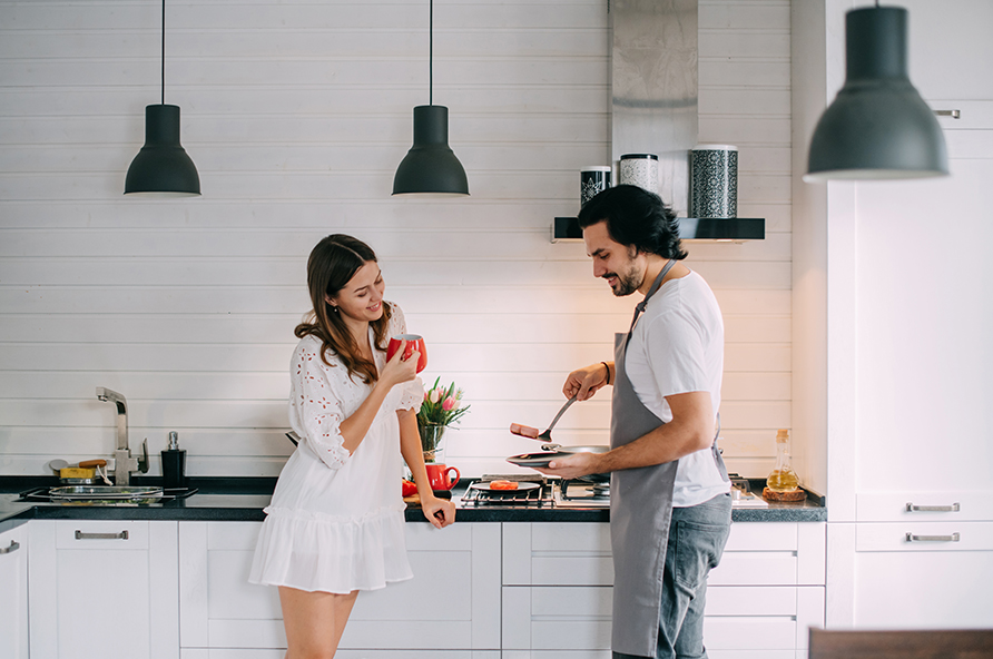 Couple in newly remodeled kitchen