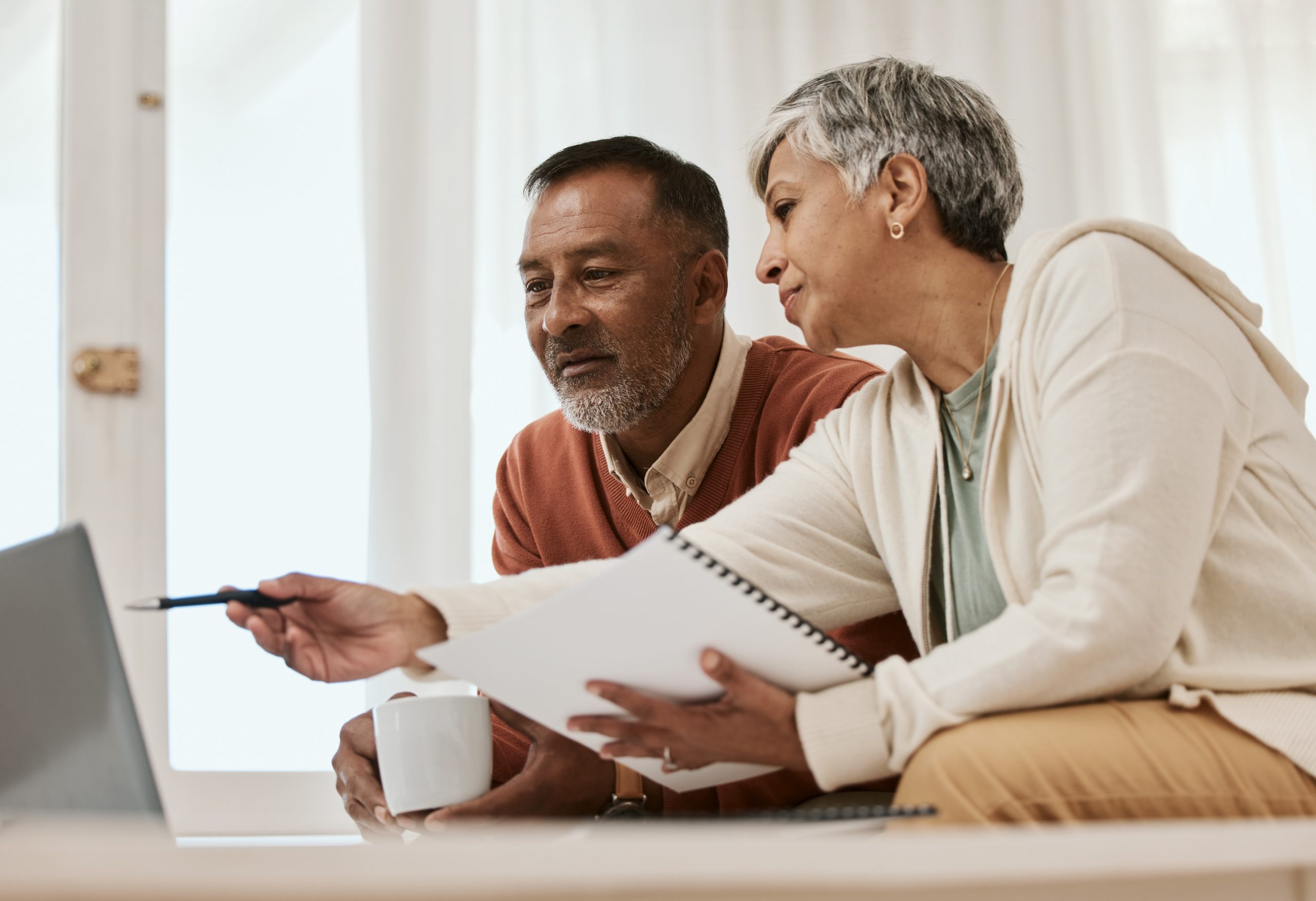 Mature couple looking at computer